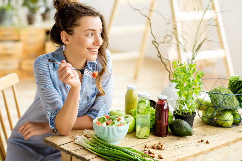 Woman eating vegetables