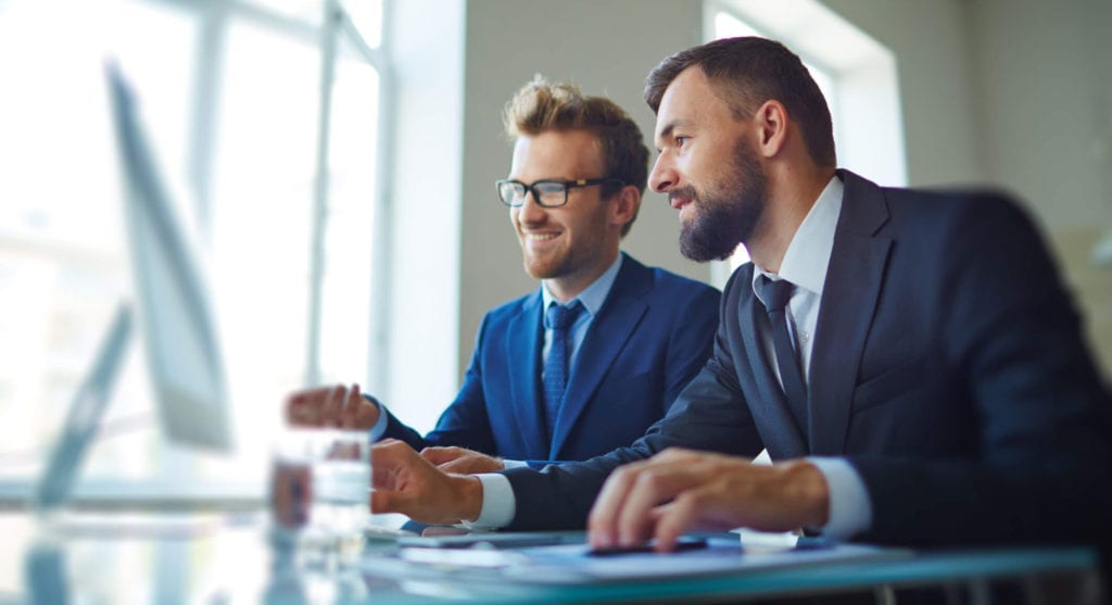 Male officemates working at the office