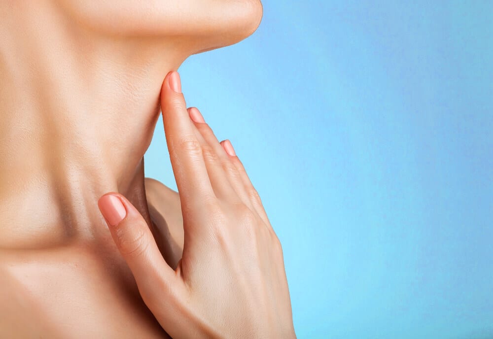 Woman touching her neck