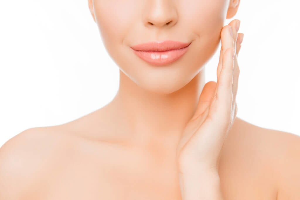 Woman touching her face