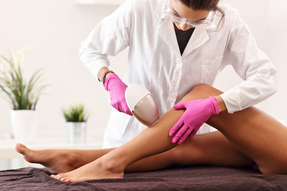 Woman having laser hair removal in professional beauty salon: Your laser skin care