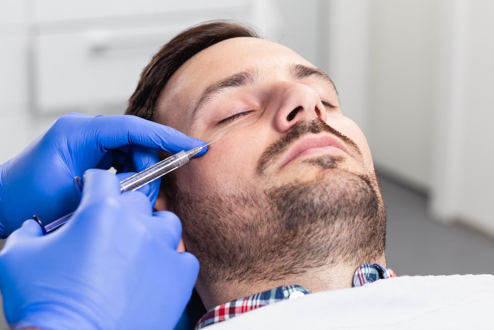 man getting under eye filler in los angeles