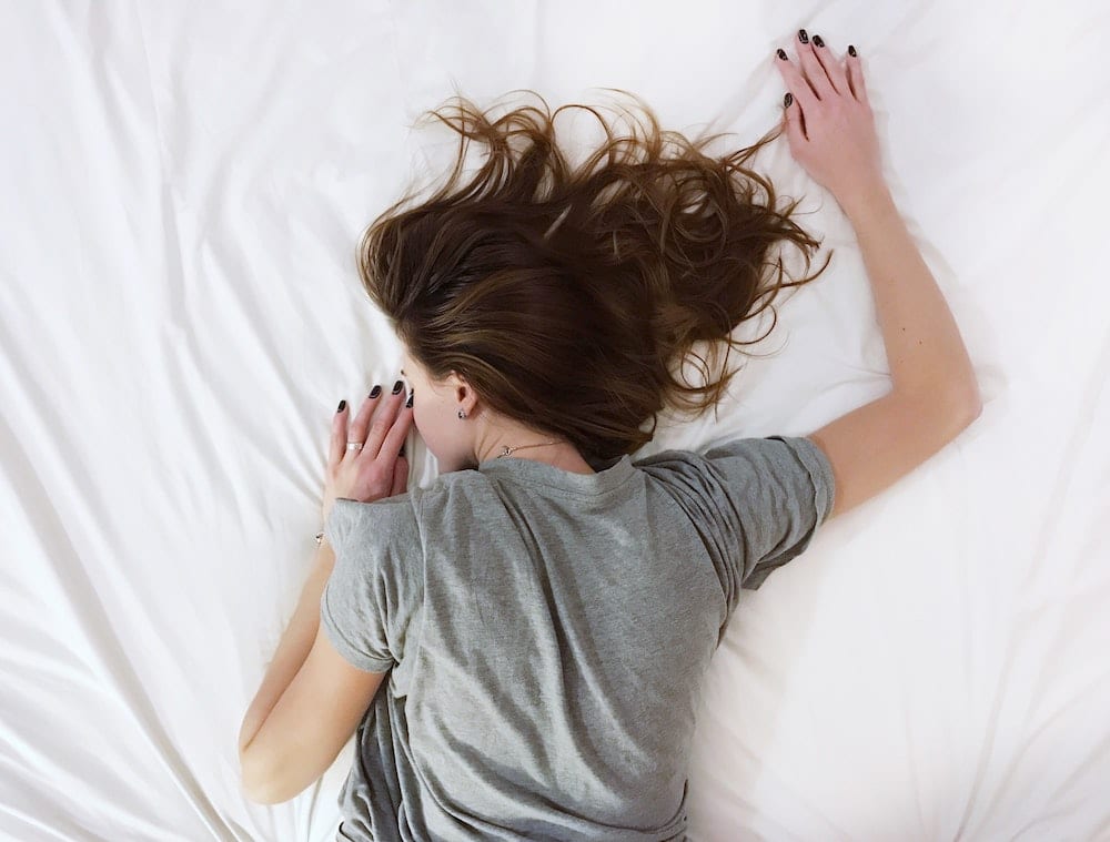 Woman sleeping on bed